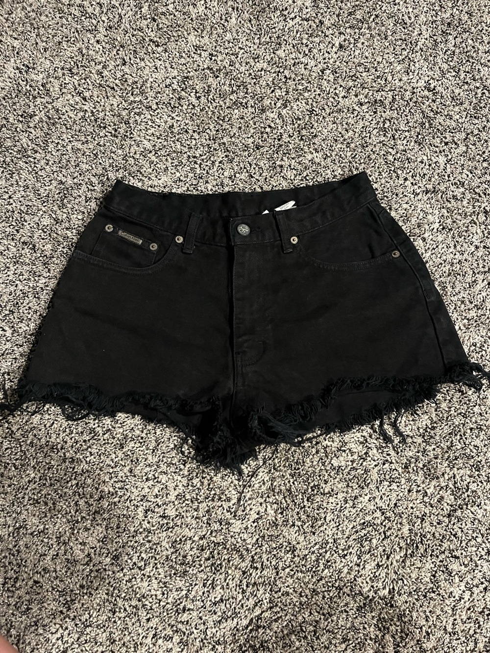 Calvin Klein high-rise black ripped shorts